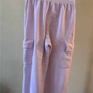 Used Juniors Pink Cargo Pants that say “Love Yourself First”